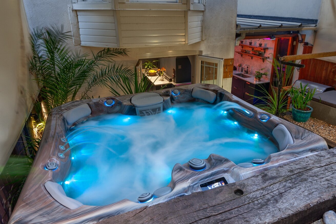 Zanzibar House private hot tub glowing blue at night