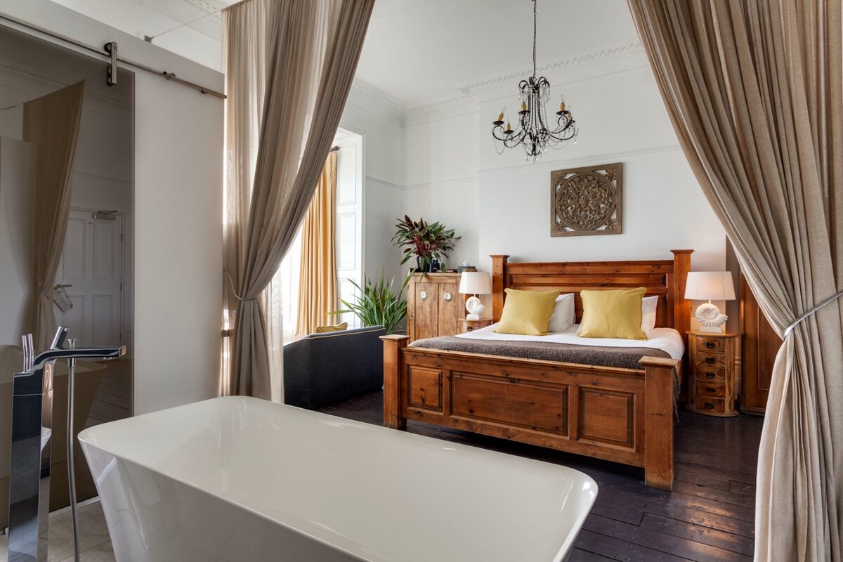 South America Room — freestanding bath with view to bedroom