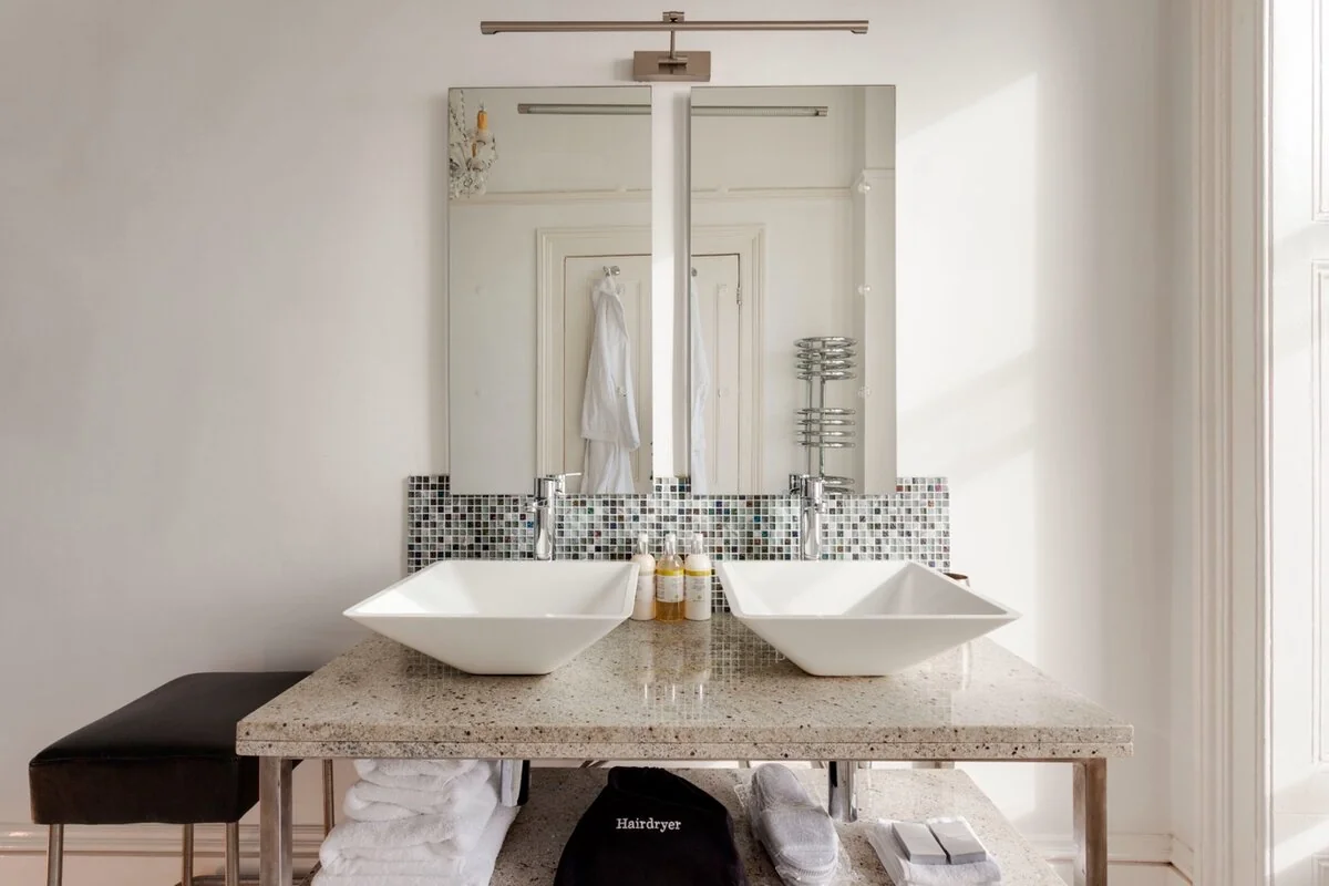Antarctica Room — double sinks with mosaic tiles and luxury toiletries