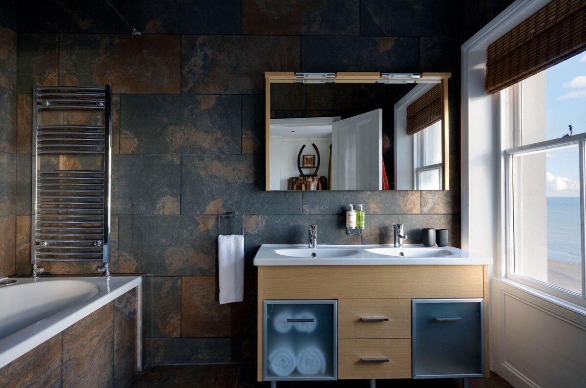 Africa Room — slate-tiled ensuite with sea view