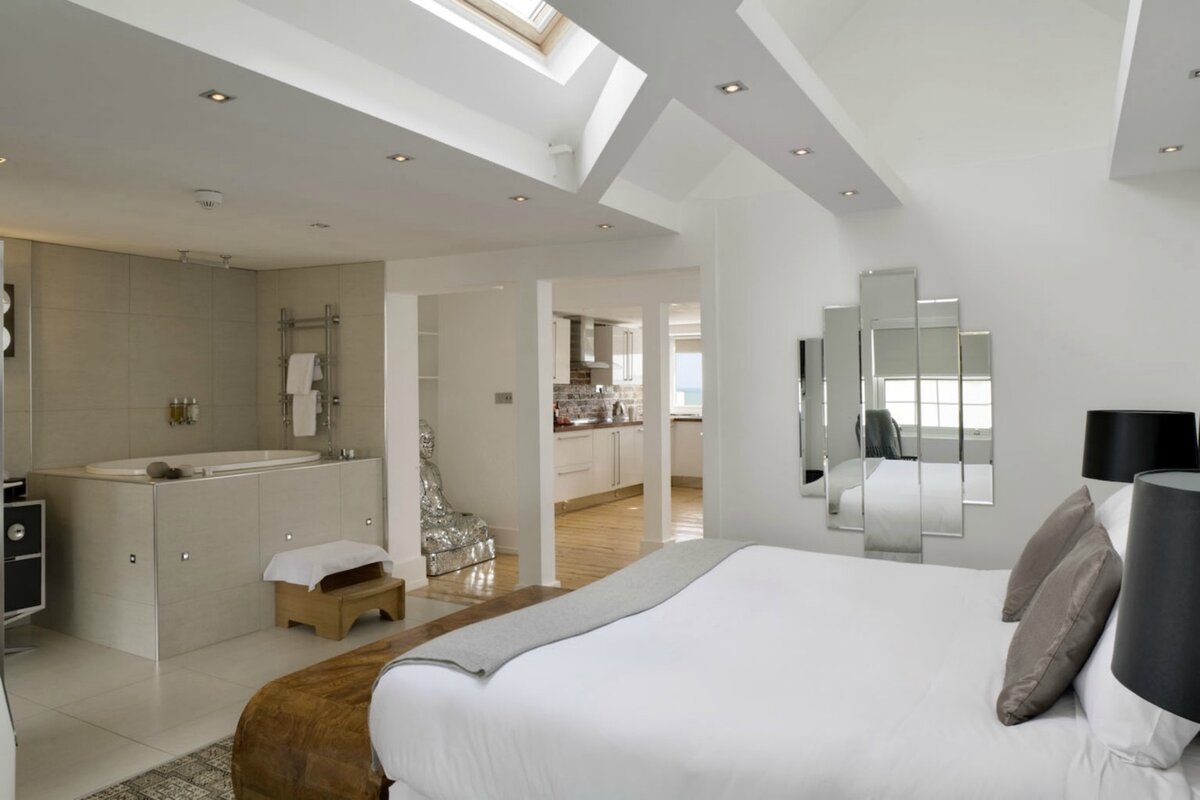 Manhattan Suite — open-plan king bedroom, bath and kitchen with skylights