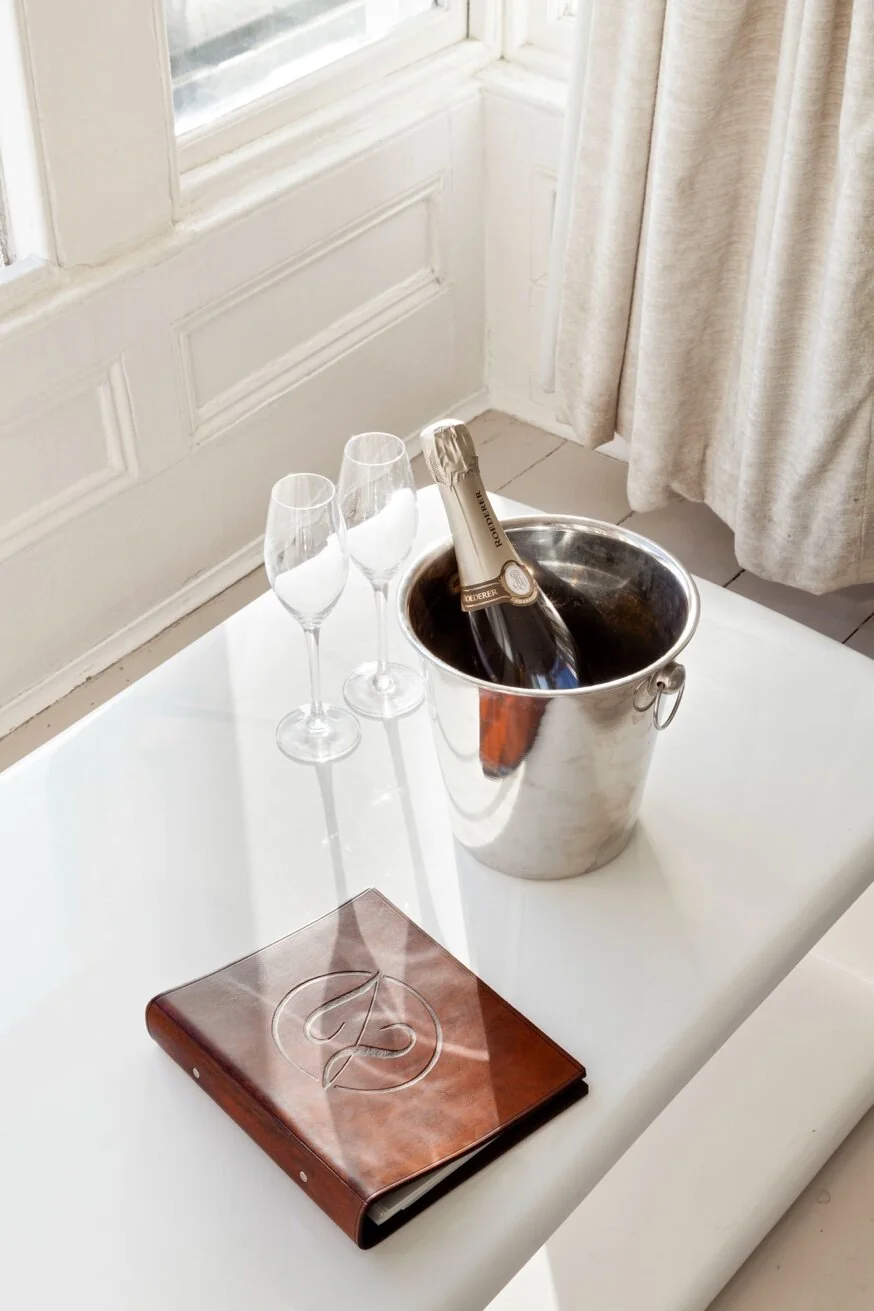 Champagne on ice with guest book in Zanzibar House bedroom