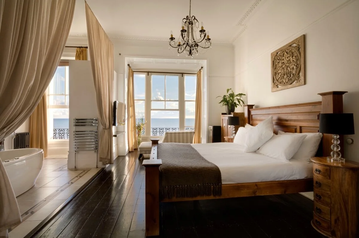 Zanzibar House seafront bedroom with freestanding bath, chandelier and sea views